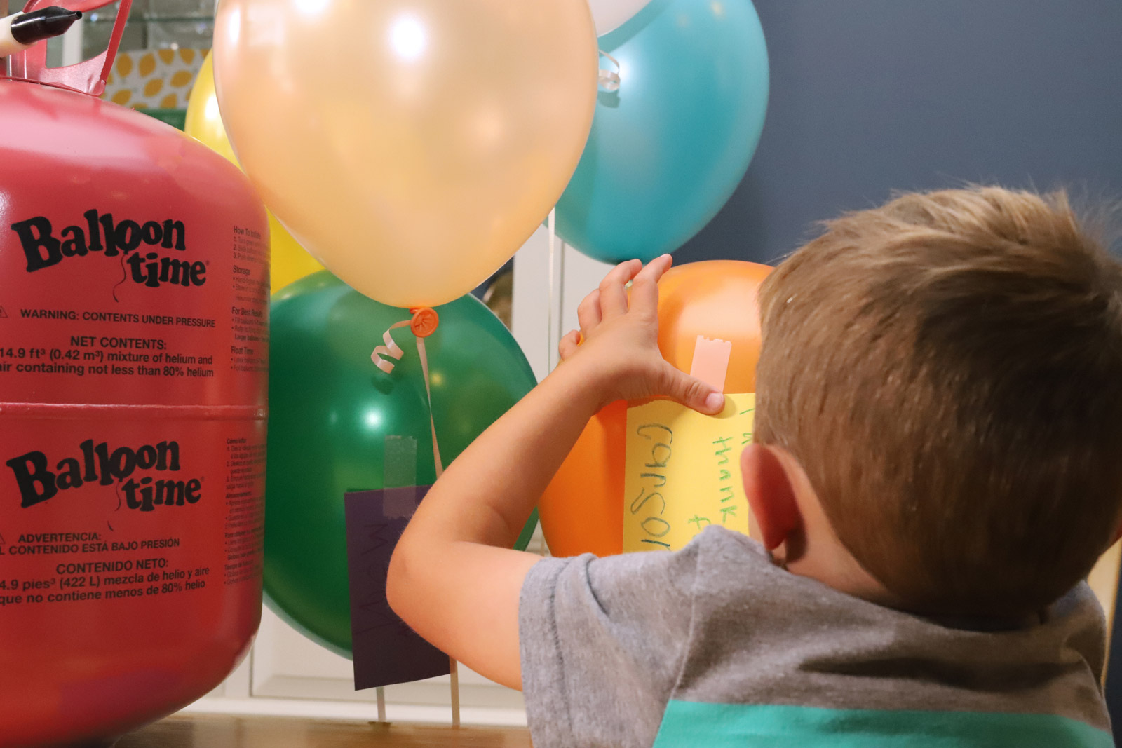 Kid creating balloon craft project