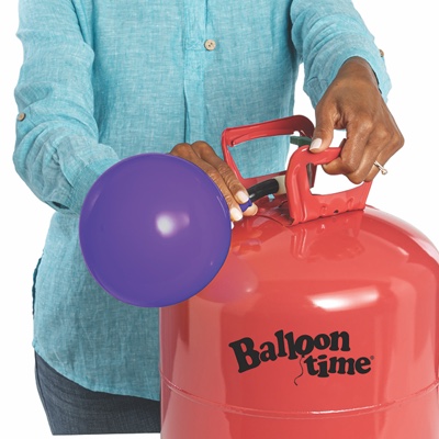 Hand placing balloon on nozzle