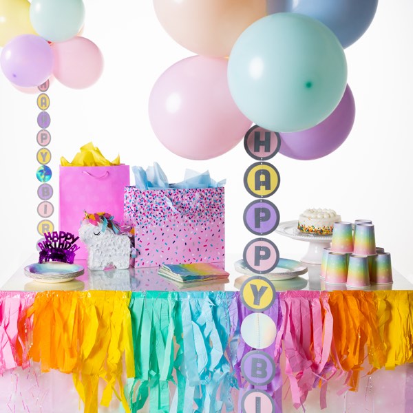 Party table with Balloon Tails and colorful balloons