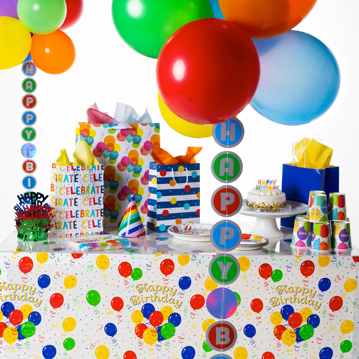 Primary color themed party table with Happy Birthday balloon tail display
